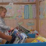 girl flicking through books