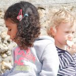 children eating at the beach