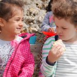 children eating at the beach