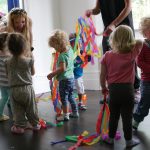 children holding streamers