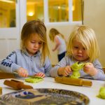 Two children playing with homemade playdough