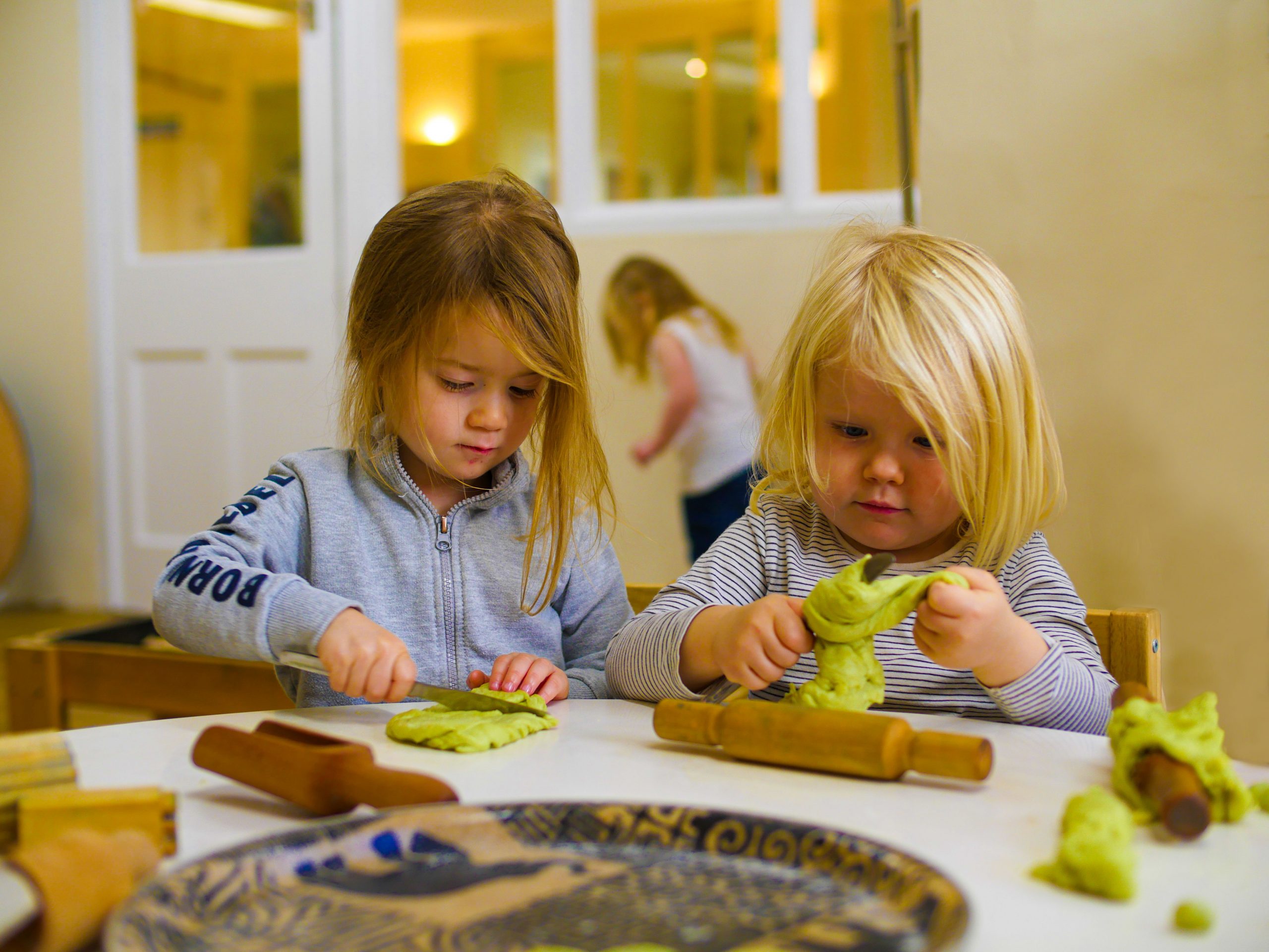 Two children playing with homemade playdough