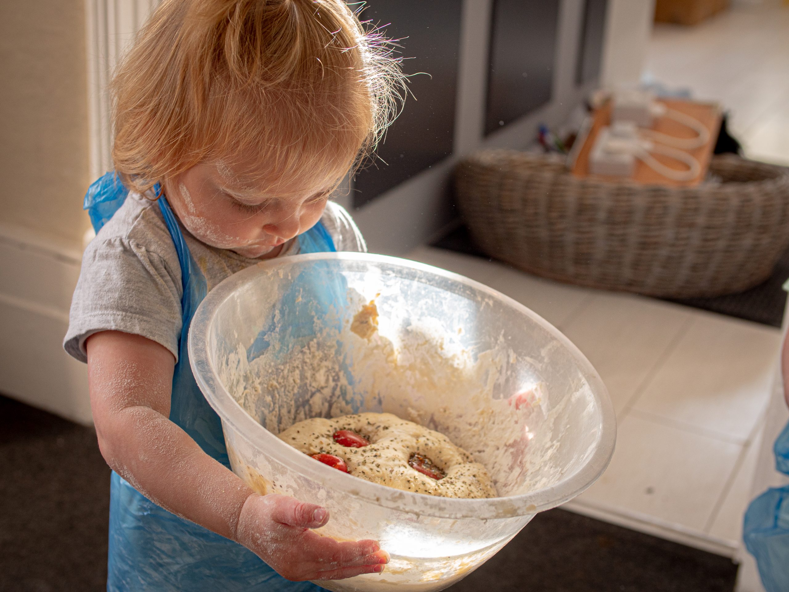 Child ready to bake bread