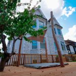 front garden with tree and sand pit