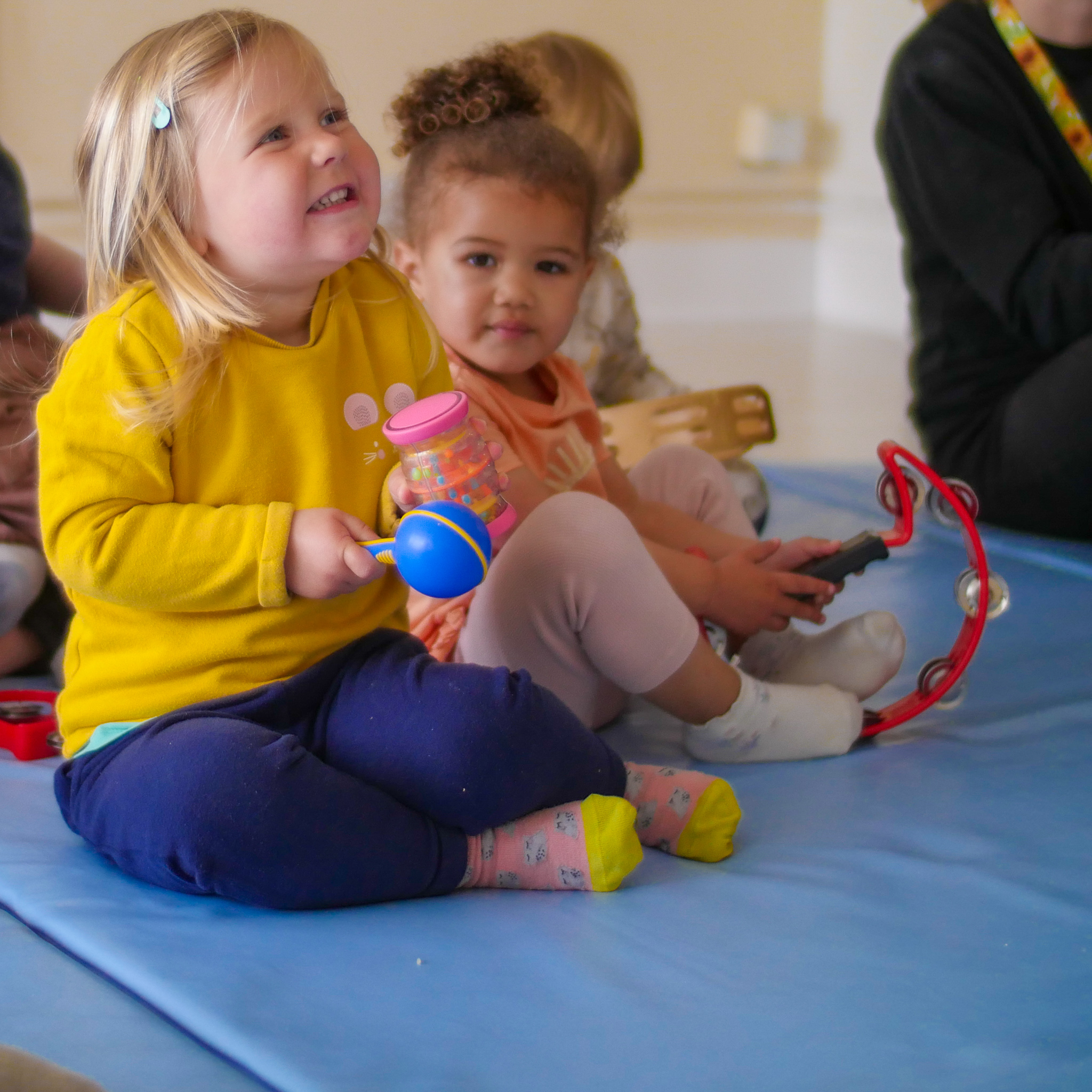 two young girls playing instruments