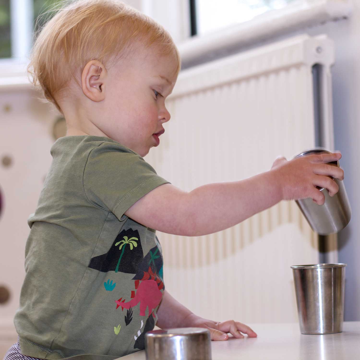 baby boy stacking cups