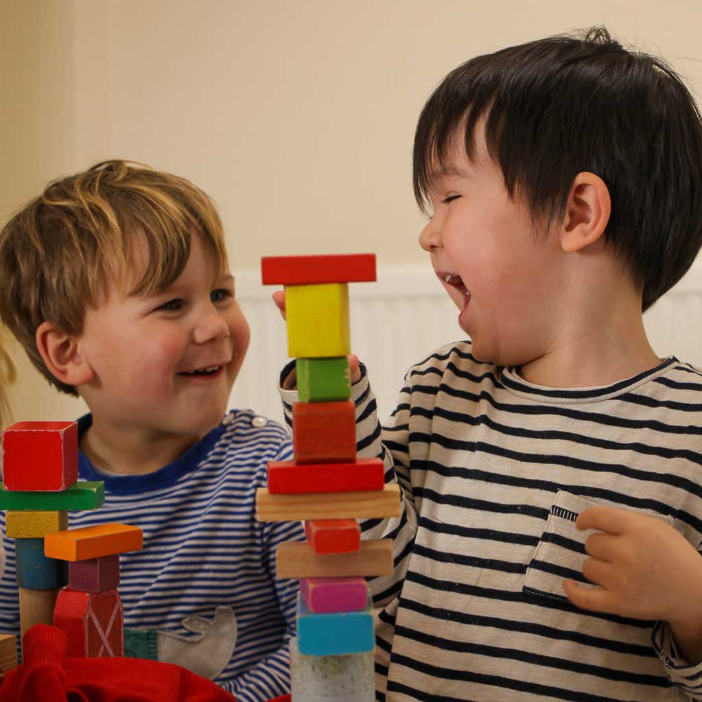 boys with building blocks laughing