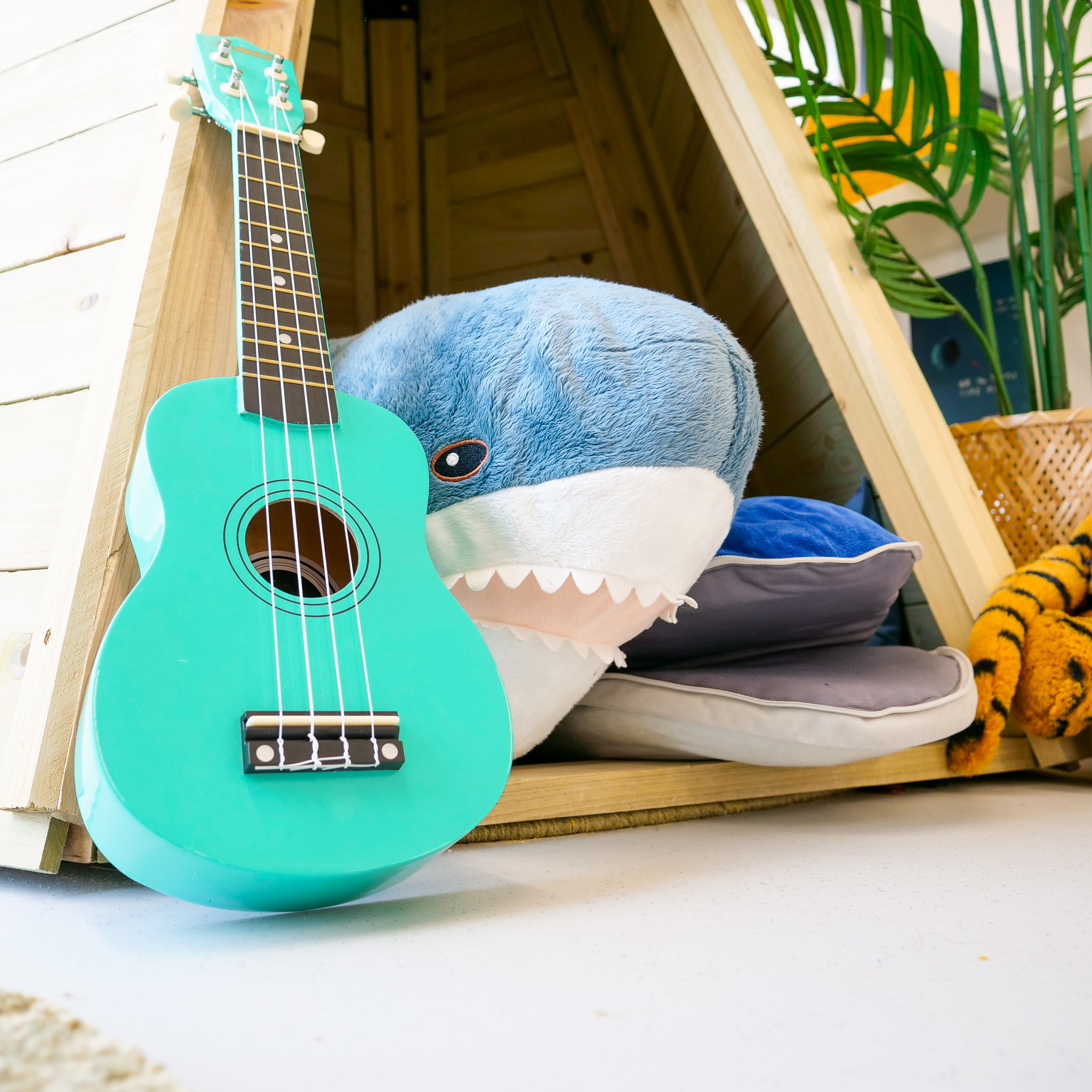 Ukuele with cuddle toy sharks