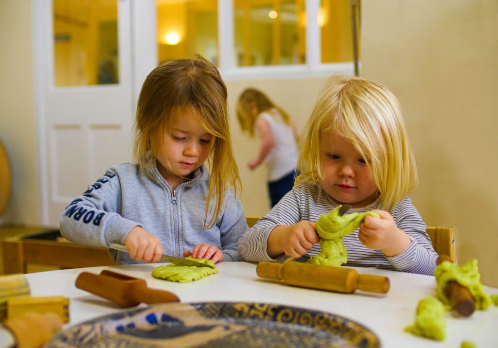 Two children playing with homemade playdough